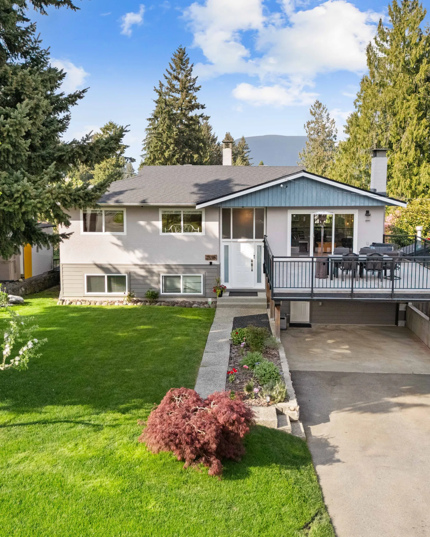 Detached home with a rear deck in the Tri-Cities, British Columbia