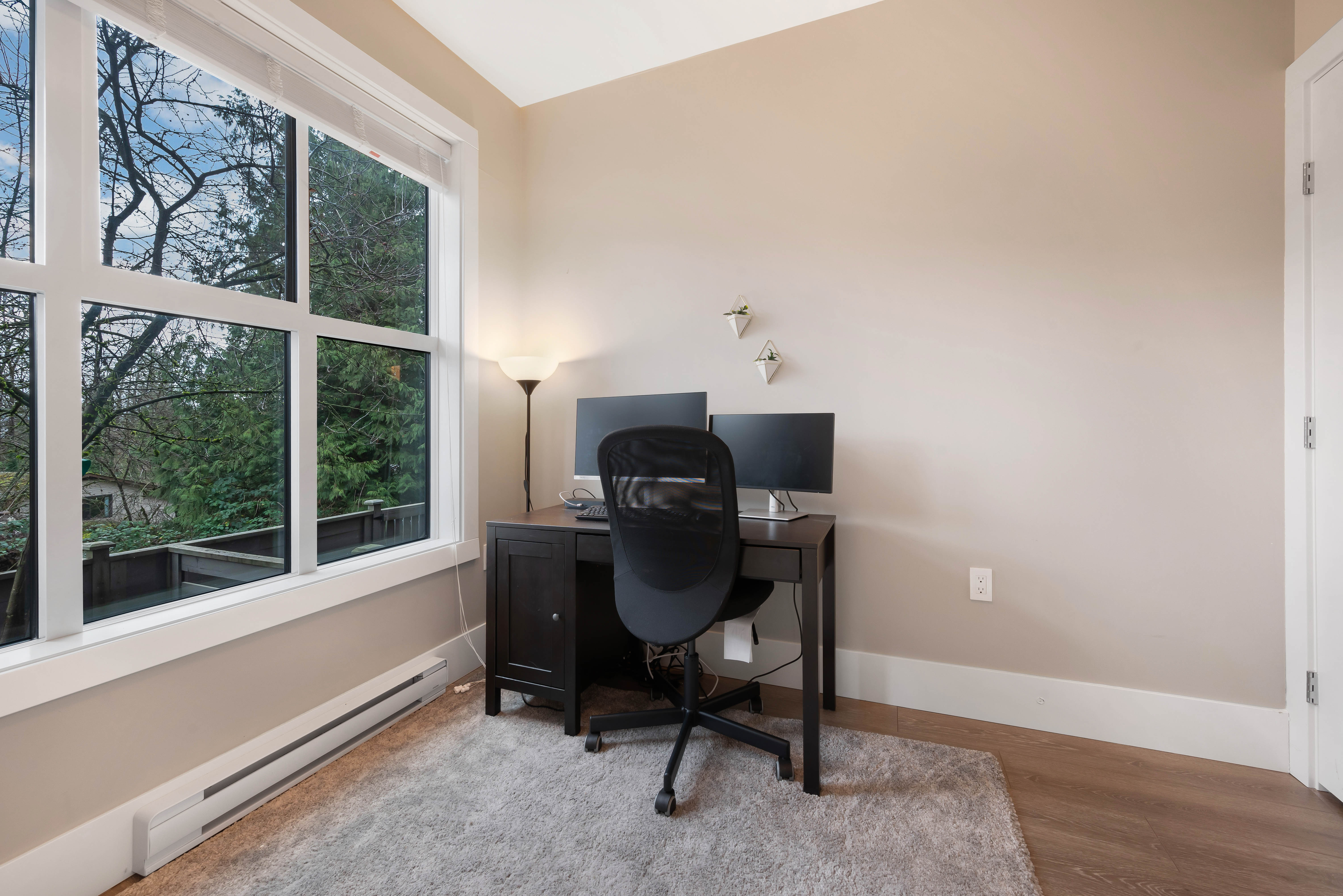 Home office with large windows
